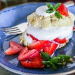 Close-up of homemade easy strawberry shortcake on a blue plate.