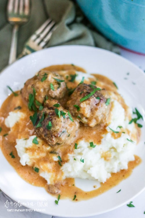This homemade version of Ikea Swedish Meatballs is a comfort food classic. Rich, savory, packed with homemade flavor, it's a family favorite. #swedishmeatballs #swedishmeatballseasy #swedishmeatballsrecipe #swedishmeatballshomemade #swedishmeatballsgroundbeef #ikeaswedishmeatballs #ikeaswedishmeatballsrecipe #ikeameatballrecipe