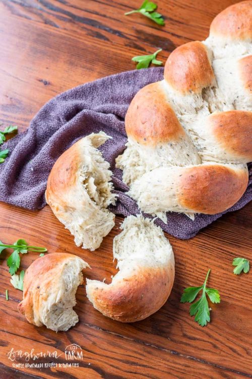 This 60 minute homemade herb bread is not only a showstopper, it's delicious and one of the easiest yeast breads you'll make! Perfect for any skill level! #herbbread #herbbreadrecipe #herbbreadrecipesimple #herbbreadrecipehomemade #herbbread #herbbreadsimple #herbbreadhomemade #herbbreadeasy #herbbreaditalian #herbbreadgarlic #herbbreadrosemary