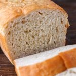 Sliced loaf of bread made from the best homemade bread recipe.