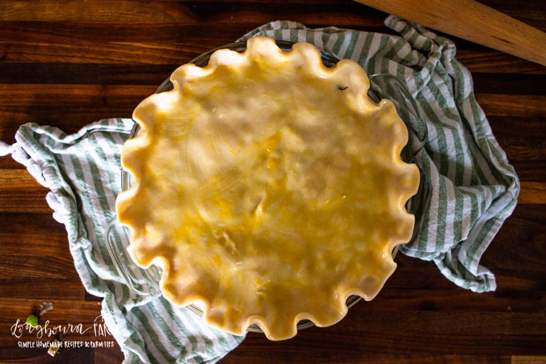 egg wash covered unbaked pie