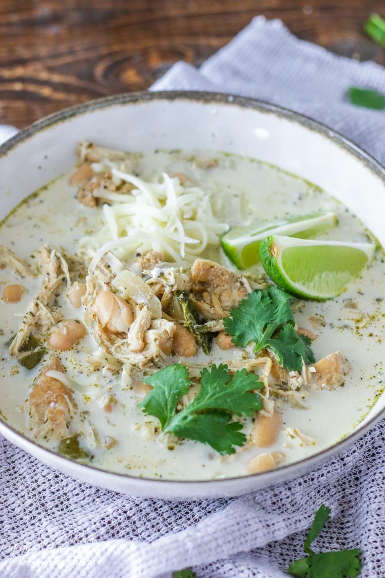 Slow Cooker White Chicken Chili is so easy to make and the perfect family meal. Completely homemade and packed with incredible flavor! #longbournfarm #slowcooker #whitechickenchili #chickenchili #easychili #slowcookersoup #slowcookermeal #crockpot #crockpotmeal #crockpotsoup