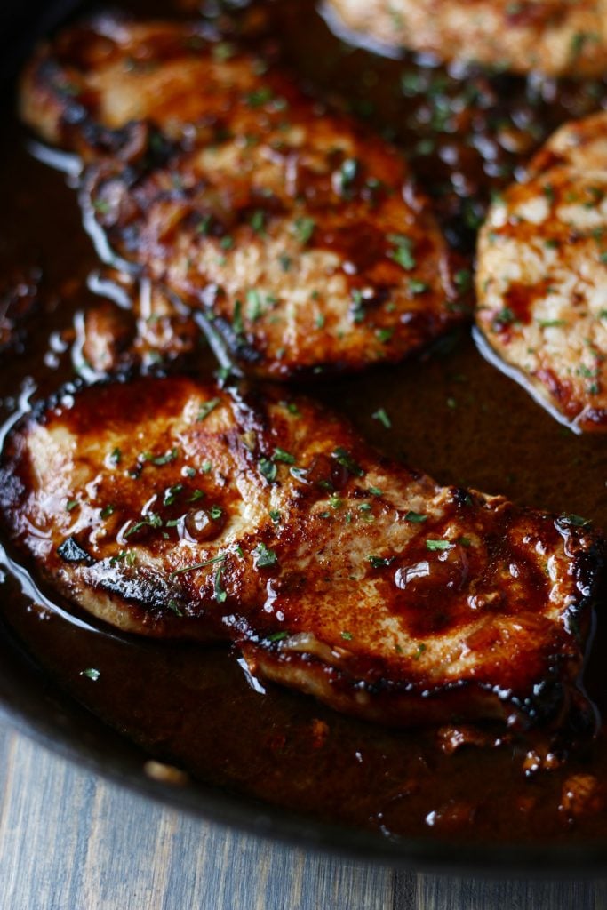 Close-up view of pan seared pork chops.