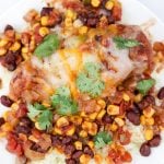 Plated slow cooker mexican chicken over rice.