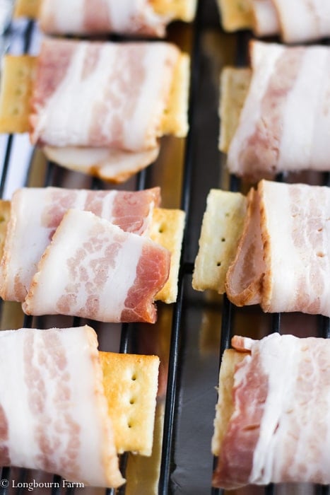 Cracker bacon appetizers on a sheet tray, close-up. 