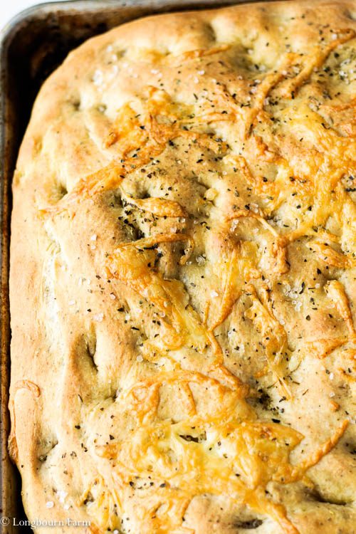 Baked homemade focaccia recipe in the pan.