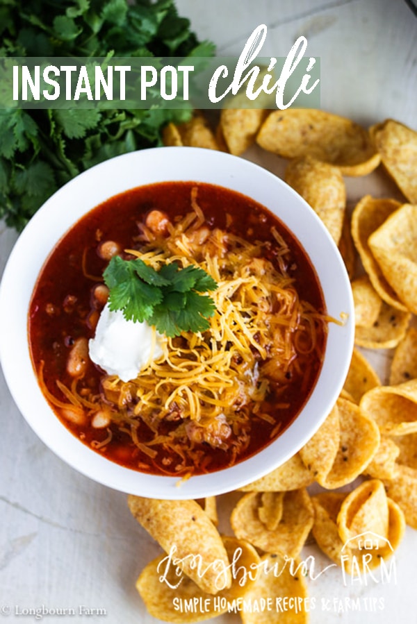 Instant Pot Chili is packed with flavor, easy to make, and family friendly!! This recipe can also be easily adapted for a slow cooker, either way you make it it's amazing! #instantpot #chili #instantpotchili #instantpotrecipe #chilirecipe #groundbeefchili #spicyfood #cornchips #cheese #sourcream #easychili #slowcookerchili