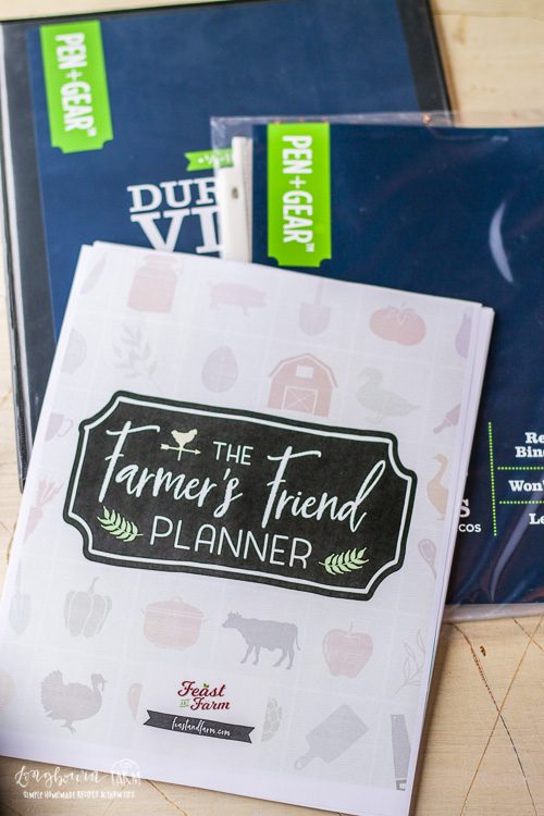 Assembly materials: printed Farmer's Friend Farm Planner, small binder, and plastic sheet protectors.