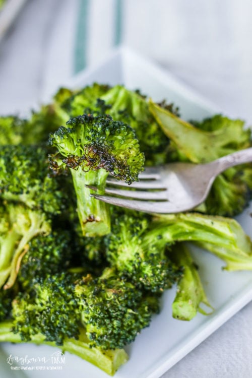 Oven roasted broccoli on a fork.
