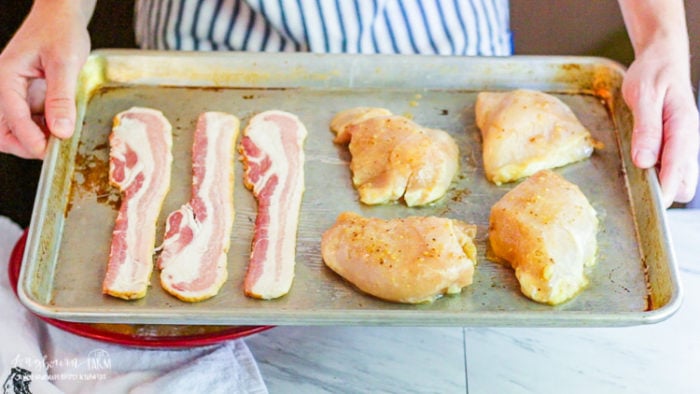 Putting the chicken and bacon in the oven.