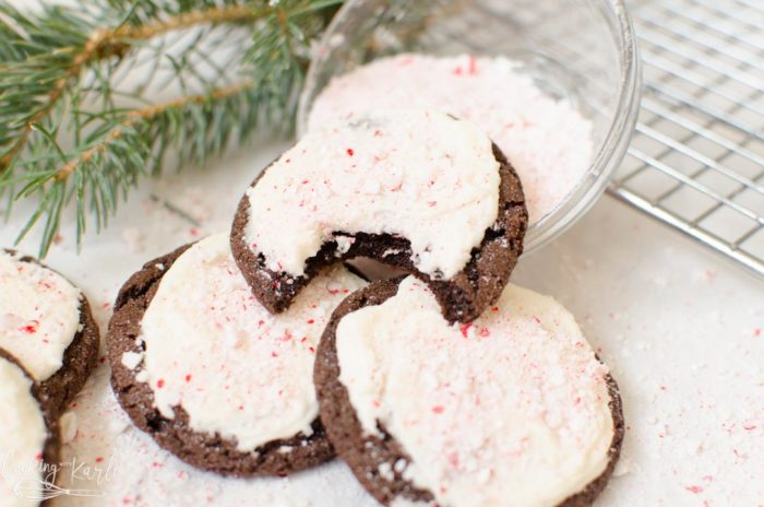 Chocolate Peppermint Cookies with Vanilla Buttercream is a soft, chewy chocolate cookie base with a creamy vanilla buttercream topped with crushed peppermint candies. The combination of flavors is so rich and festive! This will make a great addition to any Christmas or Holiday cookie platter! |Cooking with Karli| #cookies #chocolatecookies #peppermint #christmas #christmascookies #chocolatepeppermint #recipe