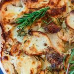 Easy scalloped potatoes are simple but creamy and flavored with fresh herbs. It's the perfect addition to any table spread and perfect for the holidays. #scallopedpotatoes #scallopedpotatoesrecipe #easyscallopedpotatoes #simplescallopedpotatoes #creamyscallopedpotatoes