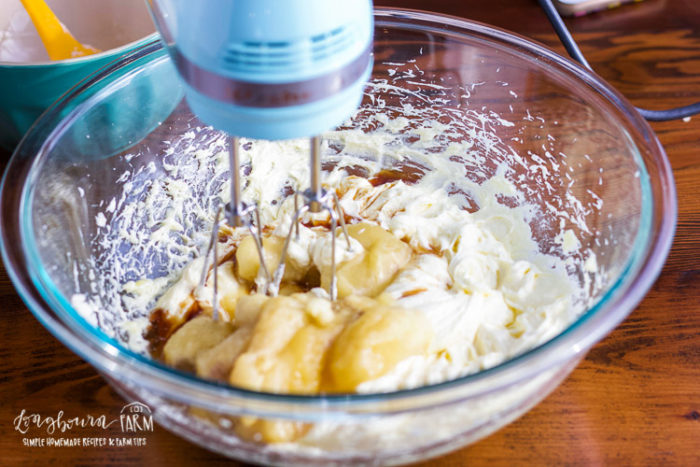 Adding bananas to creamed butter, sugar, and eggs. 