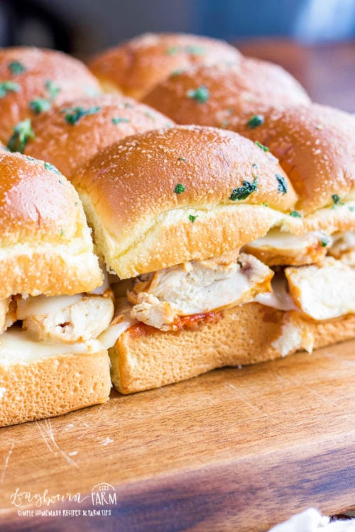 BBQ chicken sliders are so easy to put together and make a delicious meal or party appetizer! Serve them warm or at room temp, they'll be a hit either way! #chickensliders #bbqchickensliders #bbqchicken #chickensliderrecipe #chickensliderrecipes #chickensliderrecipes #bbqchickensliderrecipe #chickenslidereasy #chickensliderhawaiianrolls
