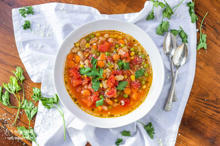 This easy vegetable soup is full of healthy, simple ingredients but still packed with delicious flavor. Ready in under 30 minutes, it's a hearty healthy meal - quick! #vegetablesoup #vegetablesouprecipe #vegetablesouprecipes #vegetablesoupeasy #vegetablesoupvegetarian #souprecipe #soupday #souprecipes