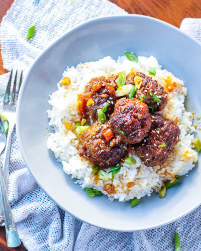 Teriyaki meatballs made in the slow cooker, served over rice.
