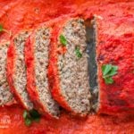Sliced homemade meatloaf recipe in a 9x13 pan.