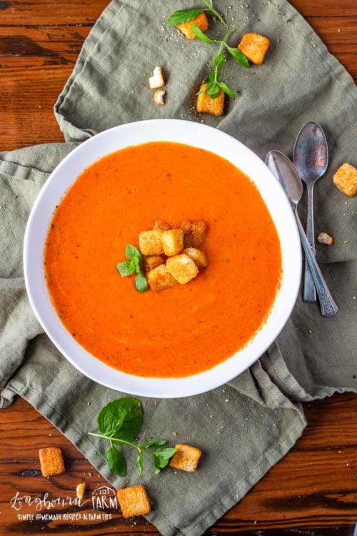 Homemade tomato soup is easy to throw together and is ready in 30 minutes. Use canned or fresh tomatoes, the flavor is perfect either way. #homemadetomatosoup #tomatosoup #homemadetomatosouprecipe #tomatosoupeasy #tomatosouphealthy #tomatosoupfreshtomatoes #tomatosouprecipe