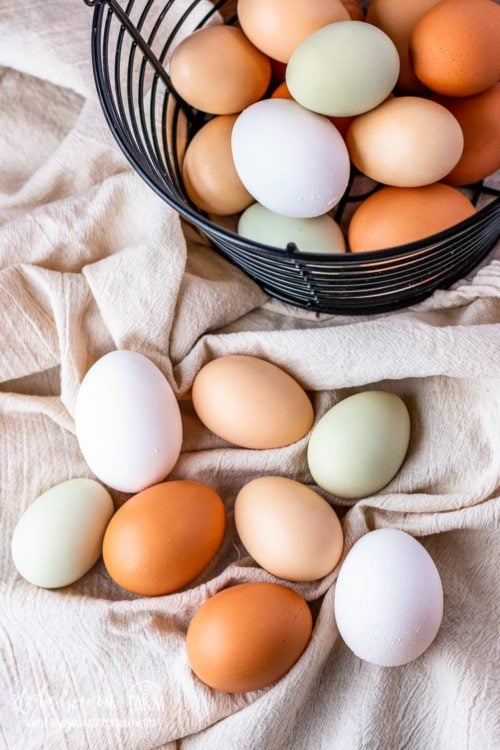 Colorful eggs on a cream colored towel.