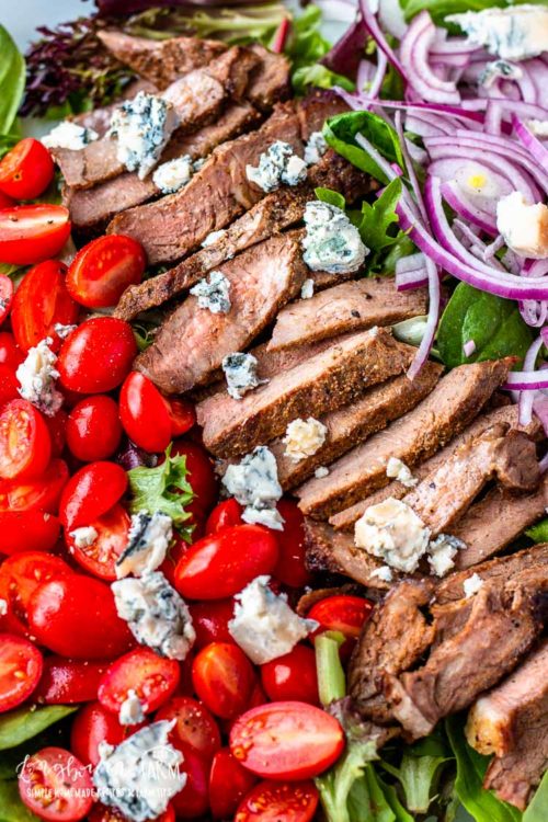 This steak salad recipe is a quick, delicious meal that's ready in minutes. The balsamic dressing is packed with flavor and the perfect pairing. #steaksalad #steaksaladrecipe #steaksaladdressing #steaksaladhealthy #steaksaladbluecheese #steaksaladeasy #steaksaladbalsamic