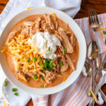 Crockpot salsa chicken is a 3-ingredient wonder meal that the whole family will love! Serve it in tacos, over rice, or bowl style. You can't go wrong! #salsachicken #easychickenrecipes #chickenrecipe #crockpotchickenrecipes #slowcookerchickenrecipes #slowcookersalsachicken #crockpotsalsachicken #salsachickenrecipe #salsachickeneasy #salsachickencreamy