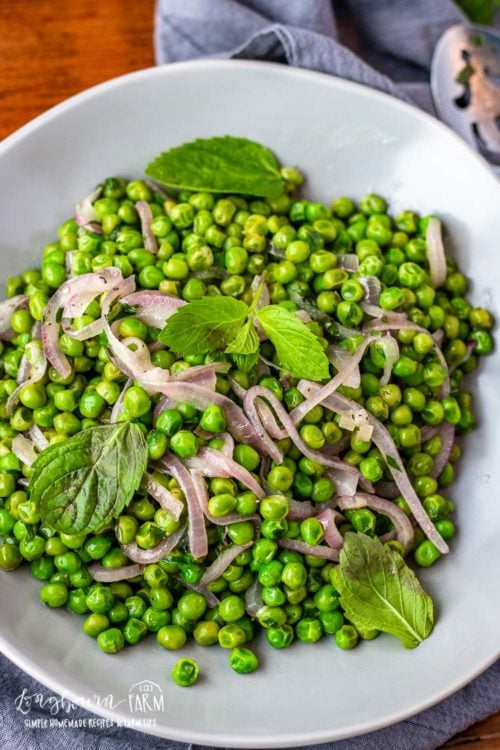 This minty peas recipe is the perfect side dish for any meal. Sweet and savory with just a hint of mint, it's the perfect balance of flavor! #peas #frozenpeas #pearecipes #mintypeas #mintedpeas #howtocookpeas #howtocookfrozenpeas