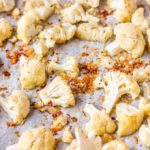 Oven roasted cauliflower is a simple and easy side dish that your whole family will love! Crispy and bursting with flavor! #ovenroastedcauliflower #cauliflower #cauliflowerrecipe #ovenroastedveggies #veggies #veggierecipe #sidedish #easyveggies #easysidedish