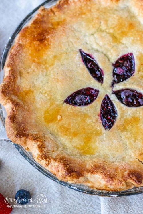 Close-up of mixed berry pie with a top pie crust. 