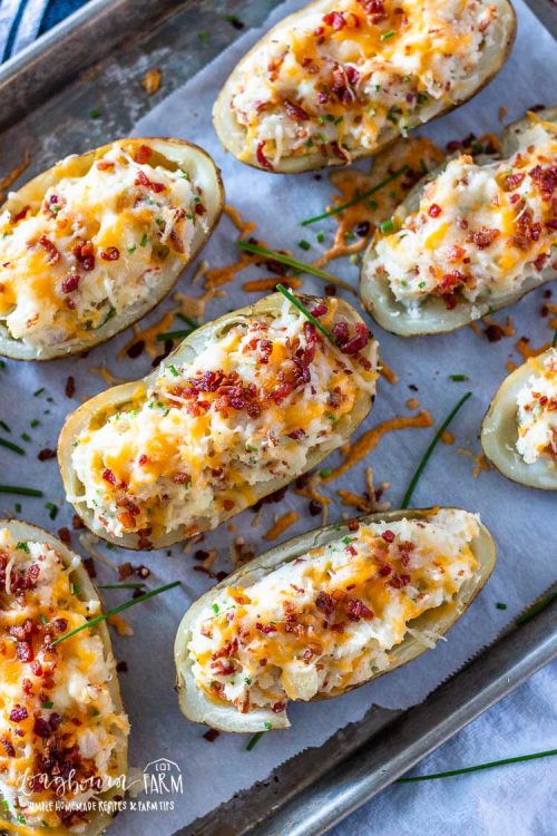 Twice baked potatoes finished on a sheet tray.
