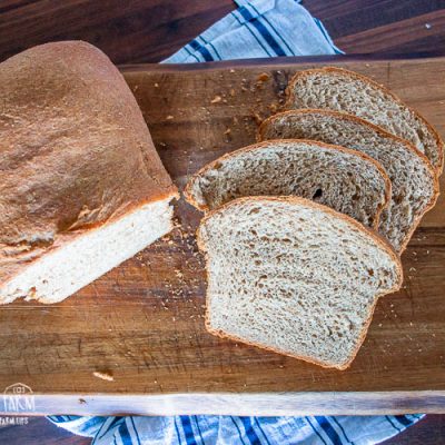 Homemade wheat bread on a cutting board.