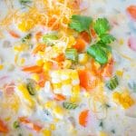 Easy corn chowder soup in a white bowl, close-up.