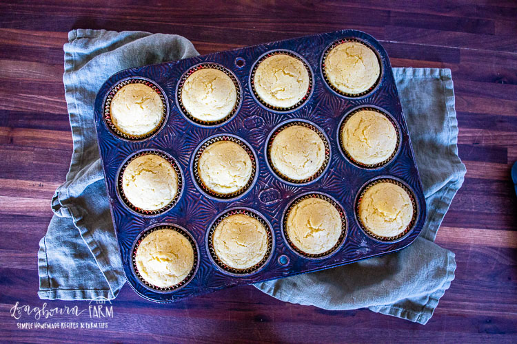 fully baked cornbread muffins in a pan