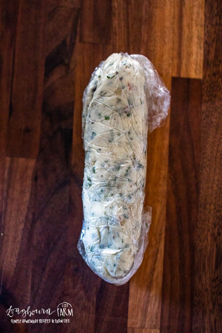 plastic wrapped log of garlic herb butter
