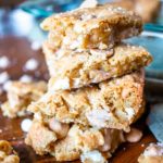 salted caramel blondies piled high in a stack