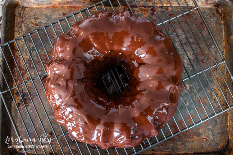 an aerial view of the ganache covered chocolate bundt cake