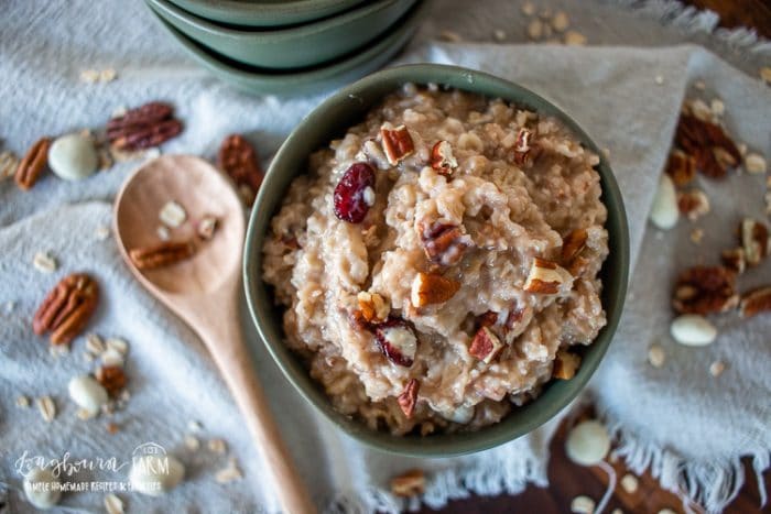pecan oatmeal in a serving bowl topped with chopped pecans