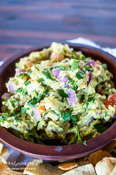 a close up of guacamole in a bowl