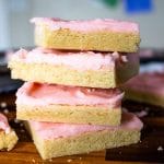 sliced and frosted sugar cookie squares stacked