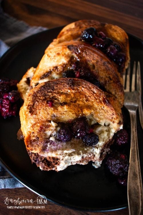blueberry baked french toast on a plate with a fork