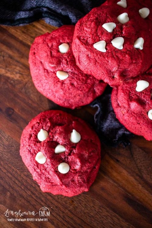 a pile of red velvet cookies with white chocolate chips
