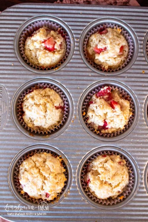 aerial view of strawberry shortcake muffins in a muffin tray