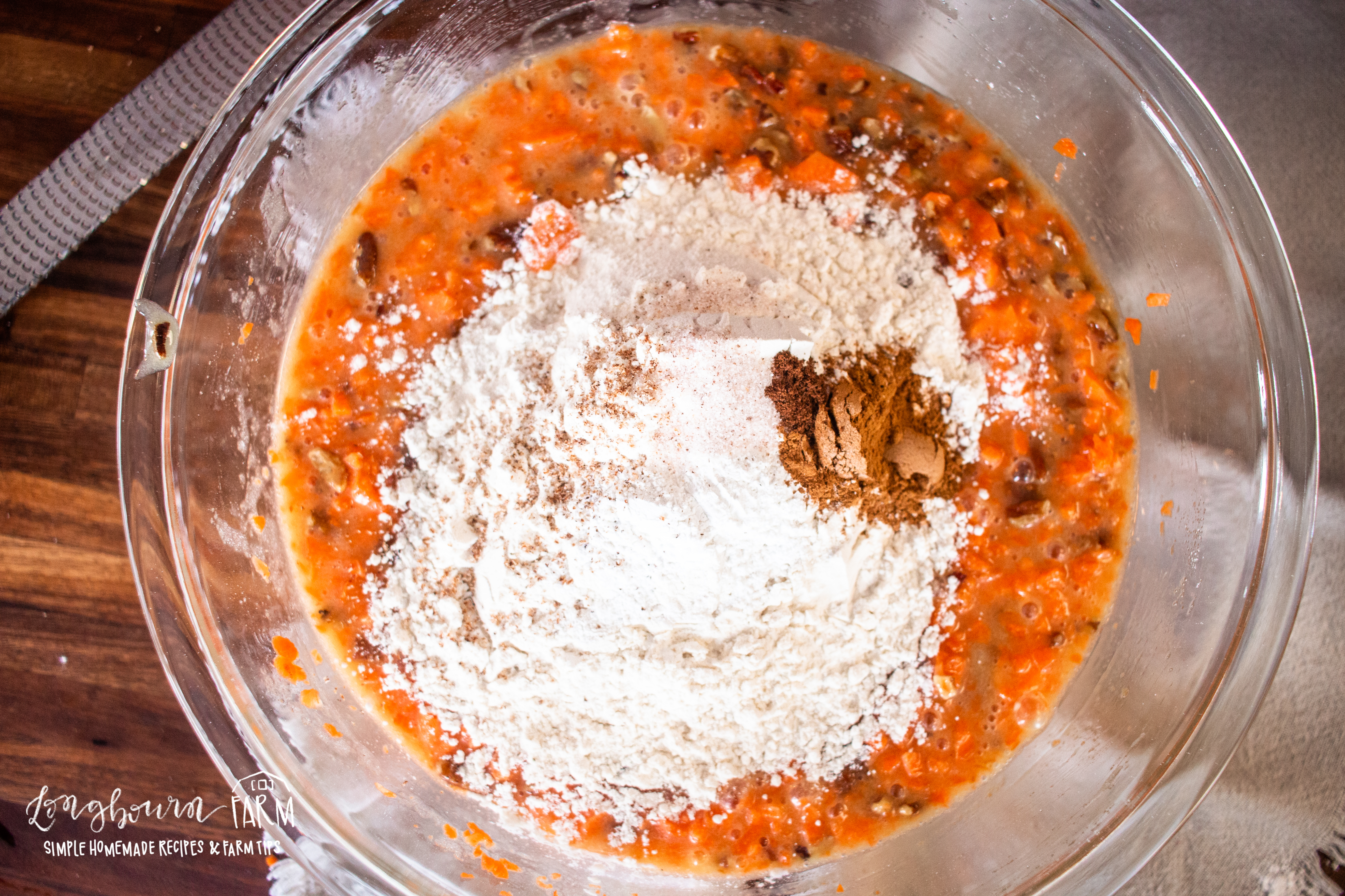 flour and spices added to the carrot wet ingredients needed for muffins