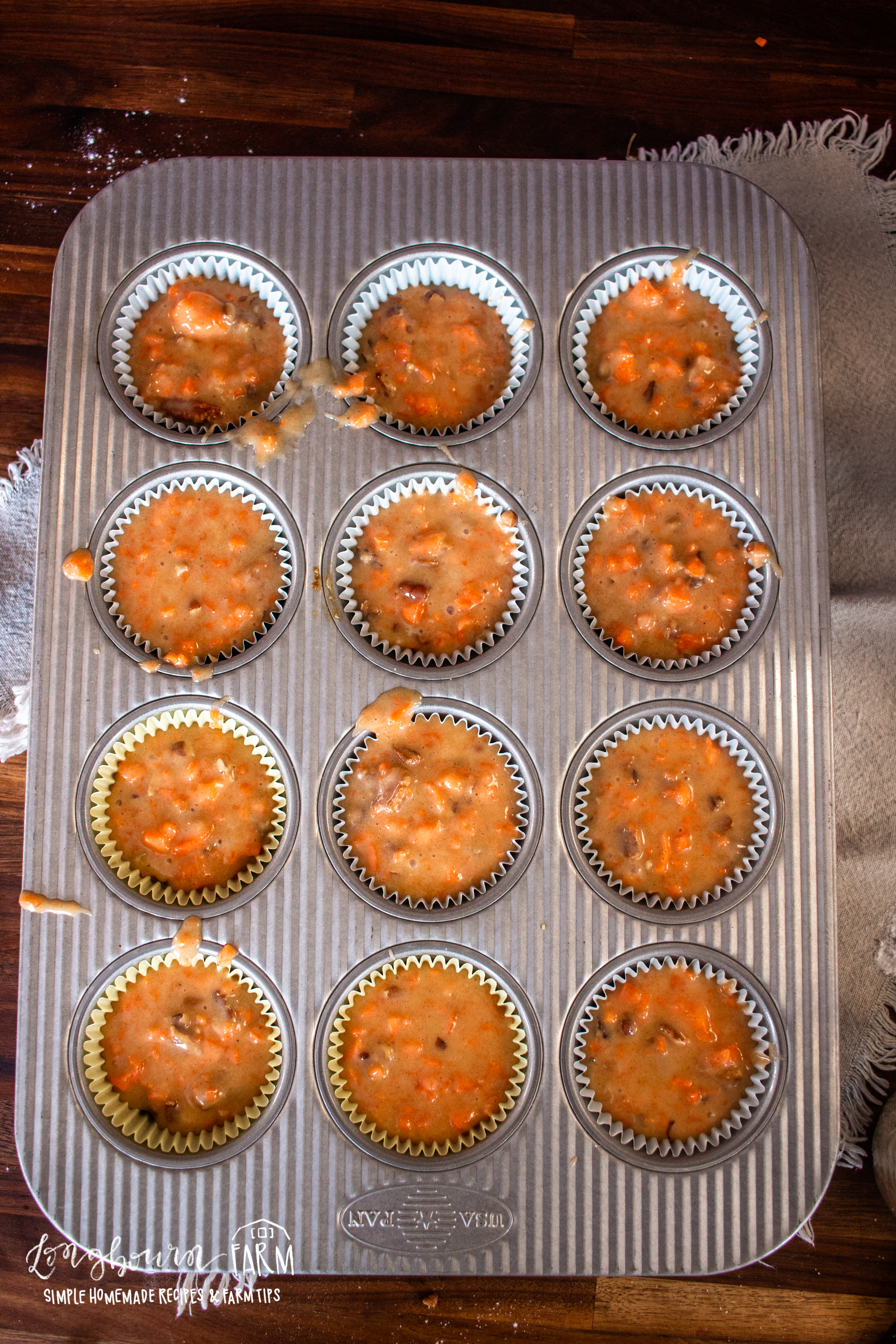 muffin tray full of carrot muffins