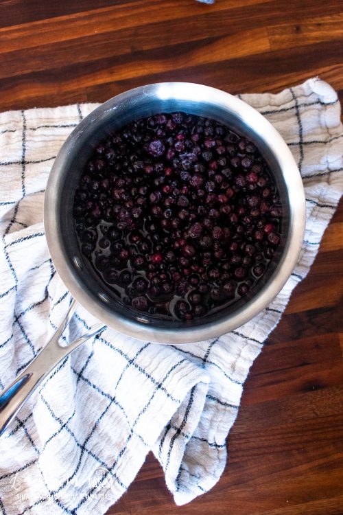 a pot of homemade blueberry syrup