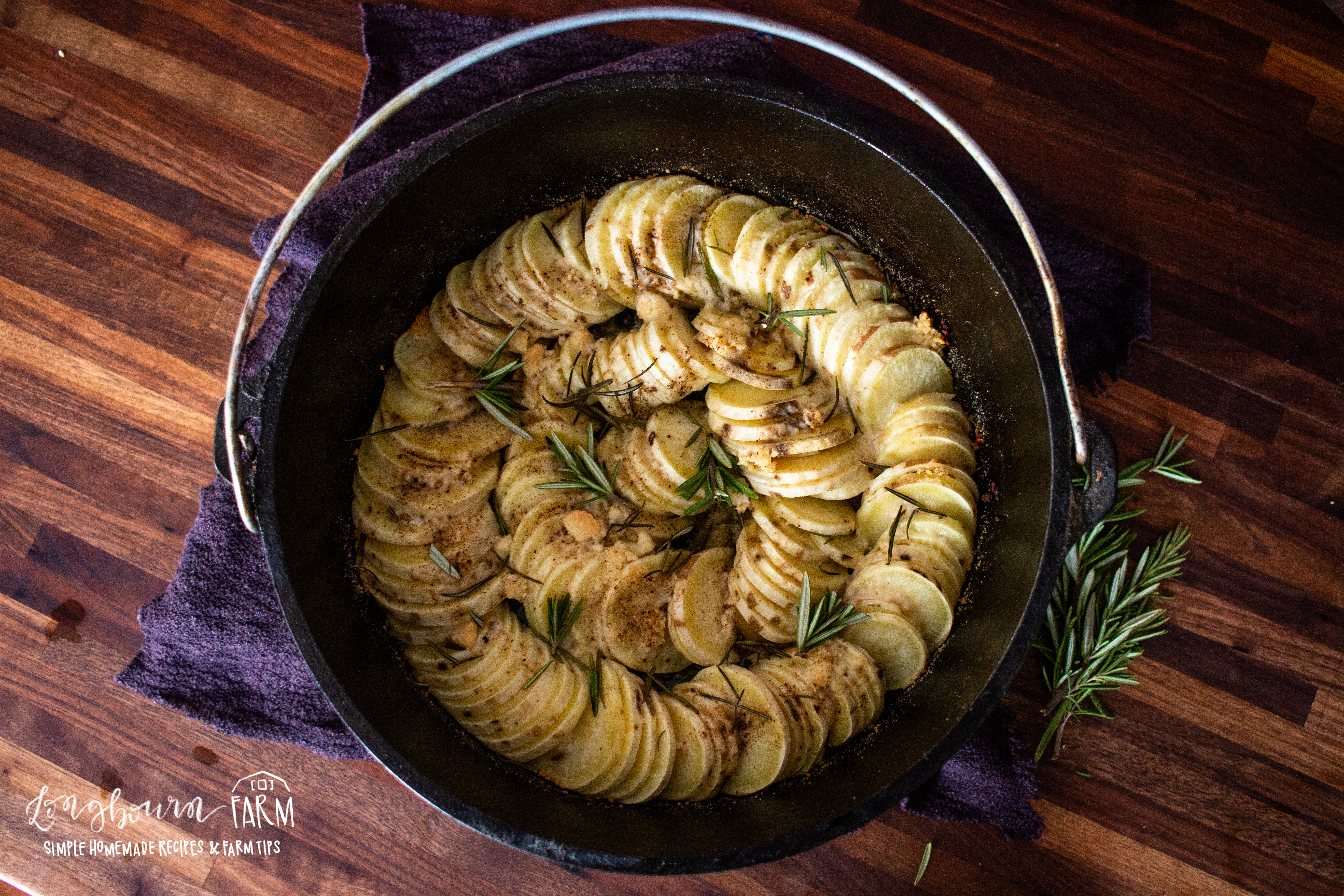 cooked dutch oven potatoes with fresh rosemary