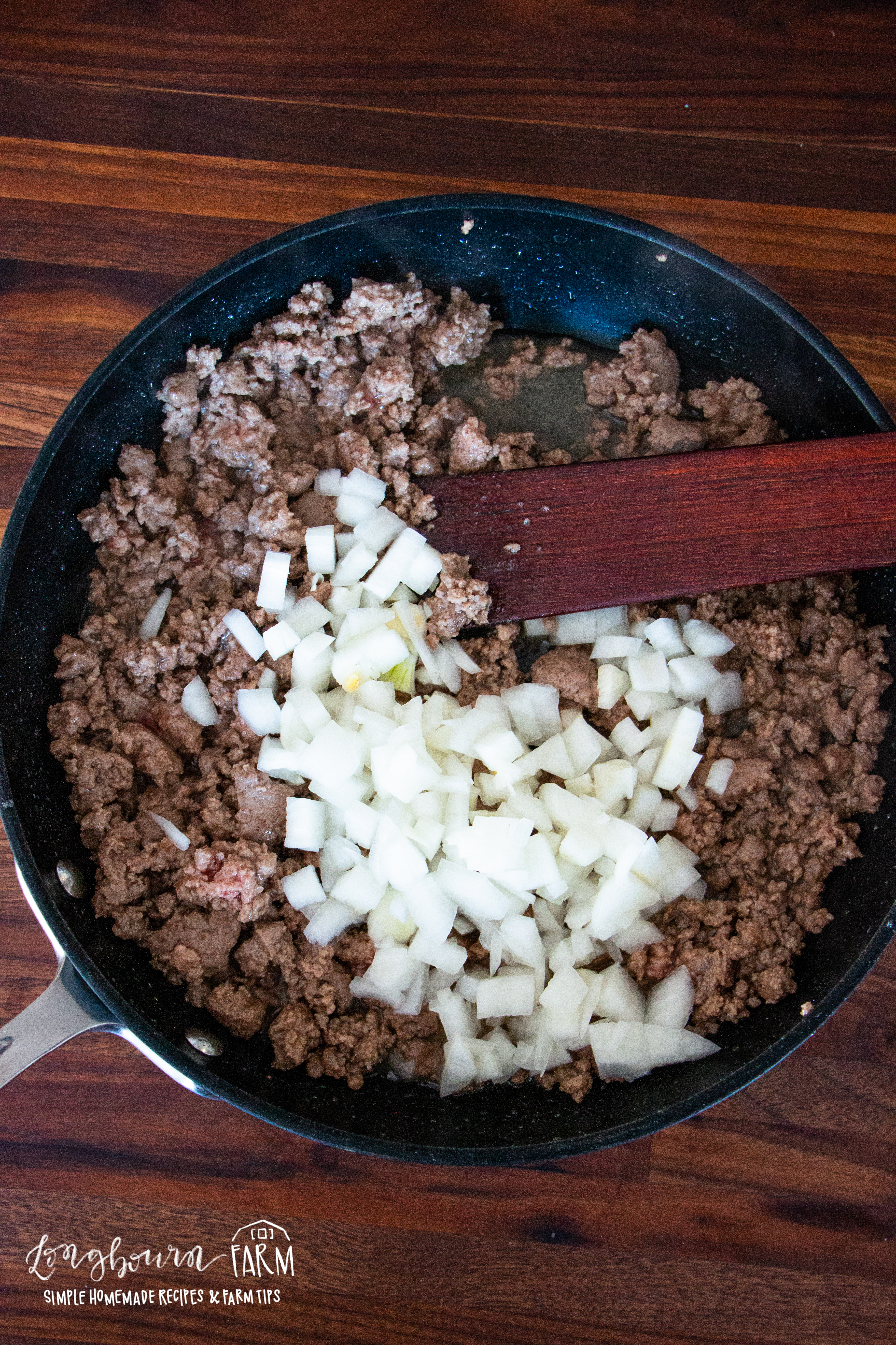 onions and cooked ground beef in a skillet