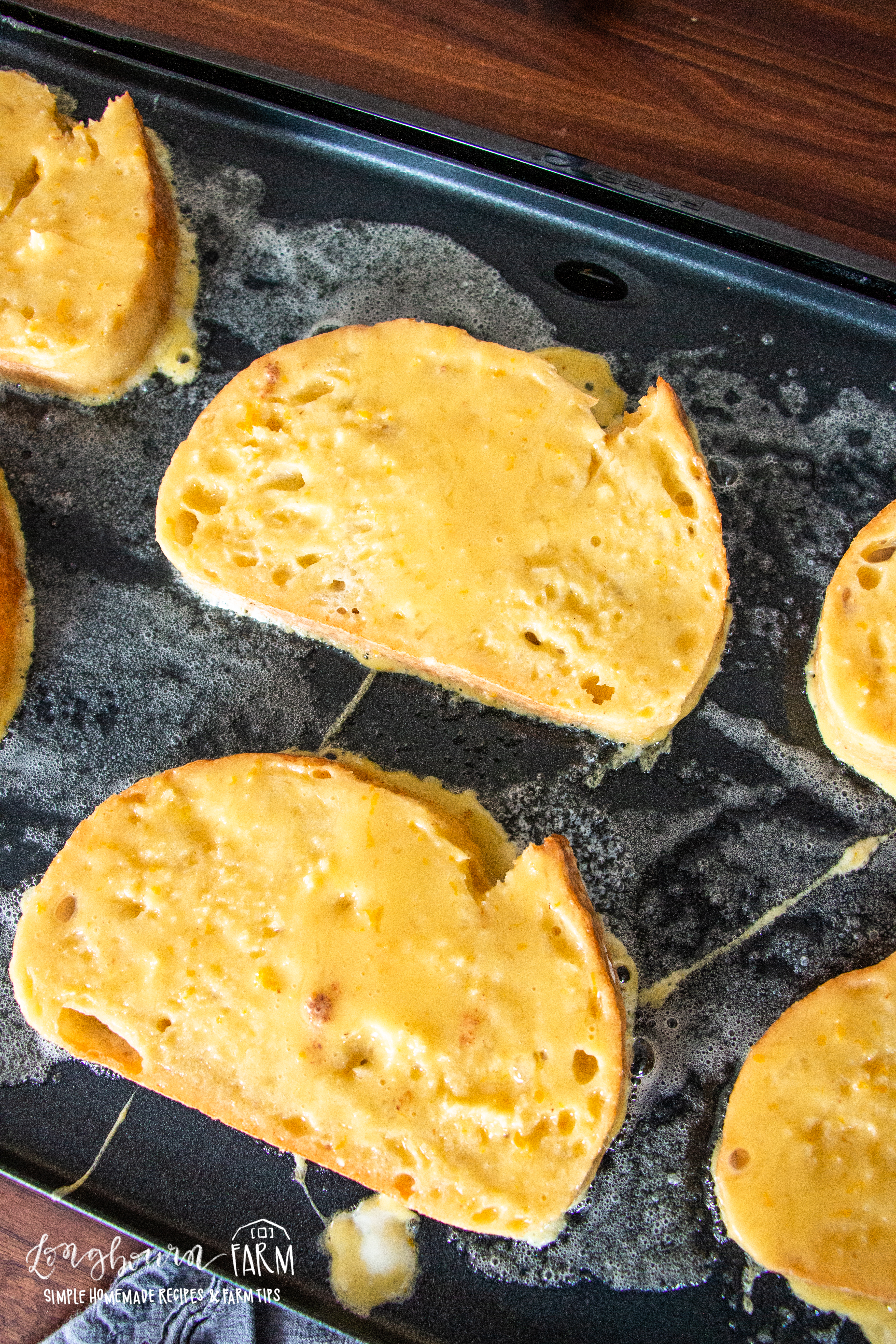 french toast breads cooking on an electric griddle