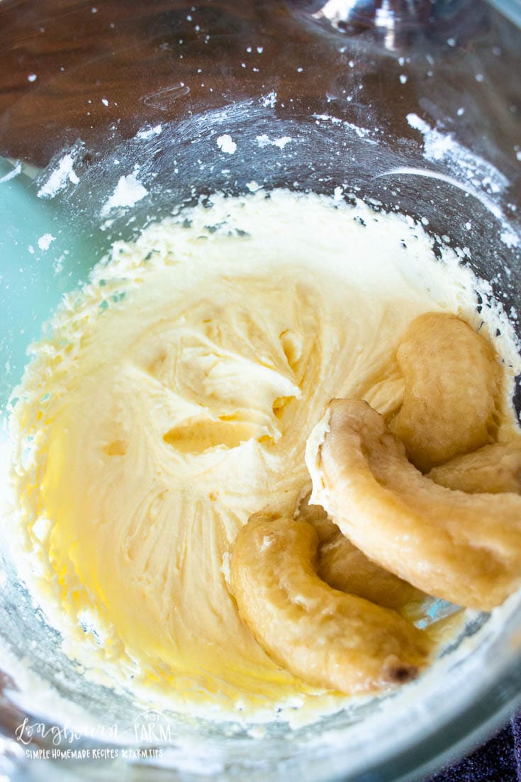 a bowl of ripe bananas and creamed butter and sugar