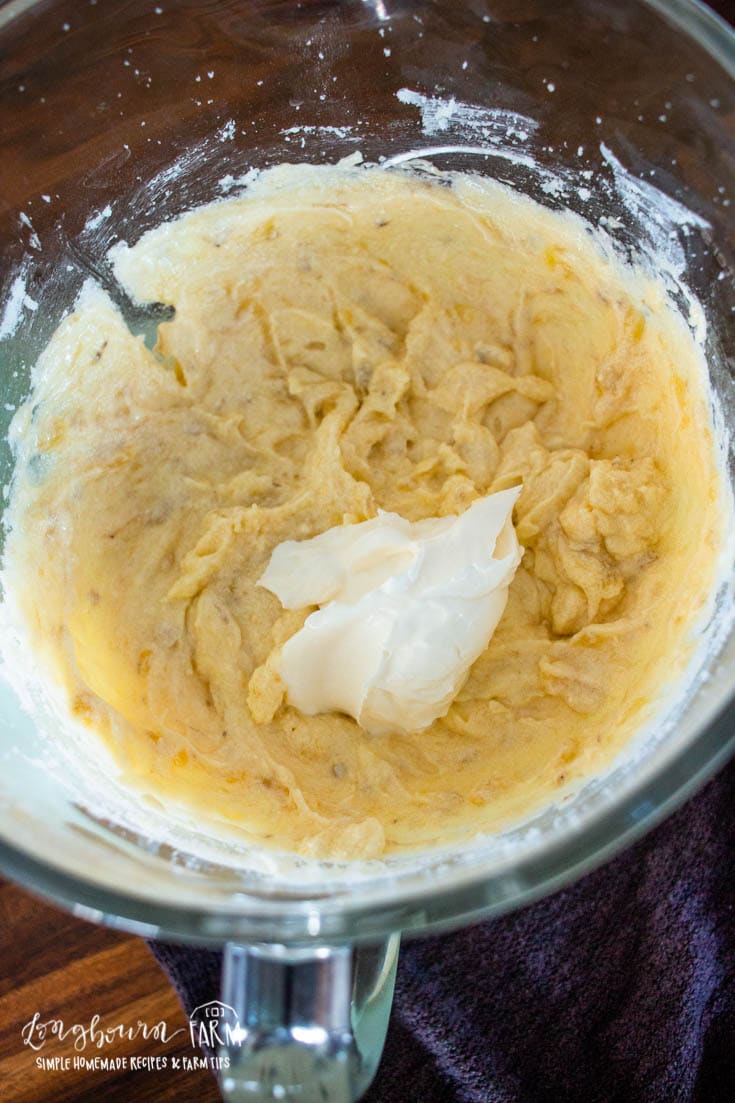 creamed butter and sugar in a bowl with sour cream