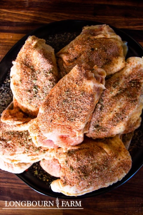 seasoning rubbed on chicken thighs